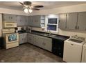 View of the kitchen, showcasing modern appliances, ample cabinet space, and a convenient laundry area at 2070 E 100 S, Lebanon, IN 46052