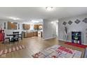 Open-concept living space, seamlessly combining living and dining areas with laminate flooring at 2868 Tindall St, Indianapolis, IN 46203