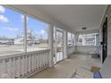 Inviting screened-in front porch perfect for relaxing and enjoying the outdoors at 2868 Tindall St, Indianapolis, IN 46203