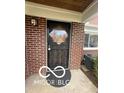 Close-up of a decorative front door with brick exterior and welcoming entrance at 3233 E 48Th St, Indianapolis, IN 46205