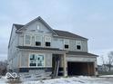 Two story house with a visible attached garage that is currently under construction at 4356 Pine Bluff Dr, Bargersville, IN 46106