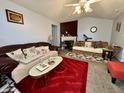 Cozy living room with comfortable seating and a decorative fireplace mantel at 5451 Kelvington Ln, Indianapolis, IN 46254