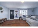 Comfortable living room showcasing hardwood floors and modern decor at 5818 S Madison Ave, Anderson, IN 46013
