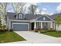 Inviting single-Gathering home with attached garage and a well-kept lawn at 7188 Covington St, Lebanon, IN 46052