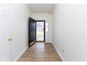 Inviting entryway with light wood flooring, a view of the front yard, and neutral-colored walls at 8091 Crumwell Dr, Avon, IN 46123
