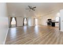 Bright and airy open-concept living space with vaulted ceilings, light-colored walls, and wood flooring at 8091 Crumwell Dr, Avon, IN 46123