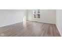 Bright bedroom features vinyl flooring and a double hung window at 8305 Warbler Way, Indianapolis, IN 46256
