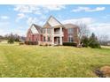 Attractive two-story home with a green lawn and beautiful landscaping at 1032 Westview Point Dr, Columbus, IN 47201
