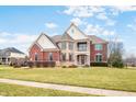 Lovely two-story home with manicured front lawn and proximity to neighborhood amenities at 1032 Westview Point Dr, Columbus, IN 47201