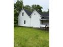 Exterior view of a well-maintained two-story home with lush green lawn at 2312 Fletcher St, Anderson, IN 46016