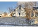 Charming white home with a well-maintained lawn and welcoming curb appeal at 2312 Fletcher St, Anderson, IN 46016