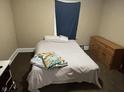 Bedroom featuring a bed and furniture, with neutral walls and carpet at 304 N Hackley St, Muncie, IN 47305