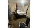 Bedroom featuring a four poster bed and carpeting at 304 N Hackley St, Muncie, IN 47305