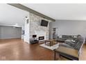 Open concept living room with fireplace, vaulted ceilings, and modern decor at 3645 Glencairn Ln, Indianapolis, IN 46205