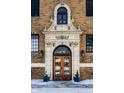 Ornate apartment entrance featuring intricate stonework and decorative lighting at 5347 N College Ave # 311, Indianapolis, IN 46220