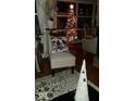 A cozy chair sits next to seasonal decorations in the living room at 5506 N Drexel Ave, Indianapolis, IN 46220