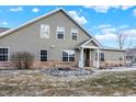 Siding and brick exterior home with a well manicured lawn at 660 Overcup St, Westfield, IN 46074