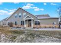 Charming home with a combination of siding and brick and a well manicured yard at 660 Overcup St, Westfield, IN 46074