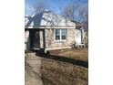 Charming single-story house featuring stone accents and a well-maintained front yard at 732 W 12Th St, Indianapolis, IN 46202