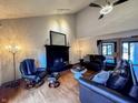 This living room features hardwood floors, vaulted ceilings and a decorative fireplace at 8150 Foxchase Cir, Indianapolis, IN 46256