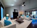 Bright living room offers hardwood floors, a black fireplace, and modern furniture at 8150 Foxchase Cir, Indianapolis, IN 46256