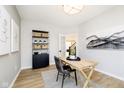 Office featuring a rustic desk, artwork, and a bookshelf at 8413 Leander Ave, Zionsville, IN 46077