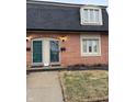 Charming brick townhouse with well-maintained landscaping and a dark roof at 8501 Canterbury E Sq, Indianapolis, IN 46260