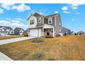 Beautiful home featuring a well-manicured front lawn and inviting front entrance at 9063 Moyer Pl, Pendleton, IN 46064
