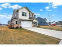 Well-maintained home with a two-car garage and a long driveway at 9063 Moyer Pl, Pendleton, IN 46064