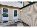 Inviting townhome entrance with sidelight windows and welcome mat at 9496 Timber View Dr, Indianapolis, IN 46250