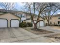 Attractive townhome featuring multiple garage spaces and landscaping, offering curb appeal and convenience at 9496 Timber View Dr, Indianapolis, IN 46250
