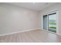 Bright bedroom featuring a sliding glass door leading to a patio and natural light at 9634 Beckett St, Avon, IN 46123