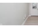 Bright hallway featuring hardwood flooring and white baseboards throughout the home at 9634 Beckett St, Avon, IN 46123