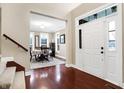 Bright foyer showcasing gleaming hardwood floors and an elegant dining room at 1057 Watertown Dr, Westfield, IN 46074