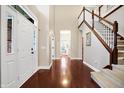 Inviting foyer boasting hardwood floors, a staircase, and a glimpse of the home's layout at 1057 Watertown Dr, Westfield, IN 46074