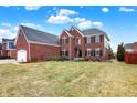Beautiful two-story brick home featuring a well-manicured lawn at 1057 Watertown Dr, Westfield, IN 46074