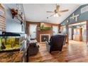 Cozy living room with a fireplace, wood floors, and vaulted ceilings at 1135 Sherwood Dr, Danville, IN 46122