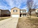 Charming two-story home with a spacious two-car garage and well-manicured front yard at 11852 Geyser Ct, Fishers, IN 46038