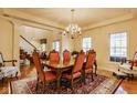 Elegant dining room featuring a large table, chandelier, and access to other living spaces at 13139 Dumbarton St, Carmel, IN 46032