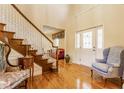 Grand foyer with hardwood floors, staircase, and a beautiful front door with sidelights at 13139 Dumbarton St, Carmel, IN 46032