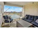 Relaxing covered patio with comfortable seating and scenic pond views at 17223 Gunther Blvd # 310, Westfield, IN 46074