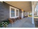 Inviting front porch with seating, ideal for relaxing and enjoying the outdoors at 227 W 7Th St, Lapel, IN 46051