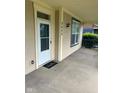 Inviting front porch with a 'hello' doormat and house number 2605 at 2605 Carrollton Ave, Indianapolis, IN 46205