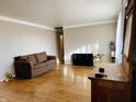 Spacious living room featuring hardwood floors, neutral walls, and classic trim detail at 3186 S Avon Ave, Plainfield, IN 46168
