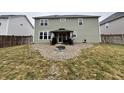 The backyard features a gravel area with a gazebo and a fire pit, perfect for outdoor gatherings at 4114 Spirea Dr, Plainfield, IN 46168