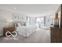 Spacious main bedroom with neutral colors, natural light, and an ensuite bathroom with double sinks at 517 Kentucky St, Fortville, IN 46040