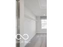 Walk-in closet with an overhead shelf, a clothing rod, and neutral carpeted floors at 517 Kentucky St, Fortville, IN 46040
