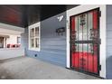 Covered front porch features a decorative security door and view to side yard at 832 N Parker Ave, Indianapolis, IN 46201