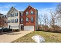 A well-maintained two-story home features a front lawn and a driveway leading to an attached garage at 9352 Tanhurst Dr, Indianapolis, IN 46250