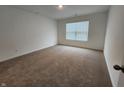 Cozy bedroom with neutral carpet, a bright window, and plenty of natural light at 11305 N Quillow Way, Monrovia, IN 46157